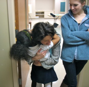 Tutors and students greet one another after a week apart